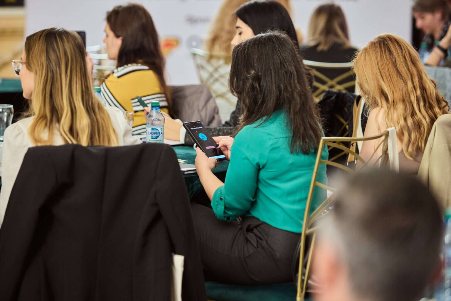 people using Stickeroo app at an event